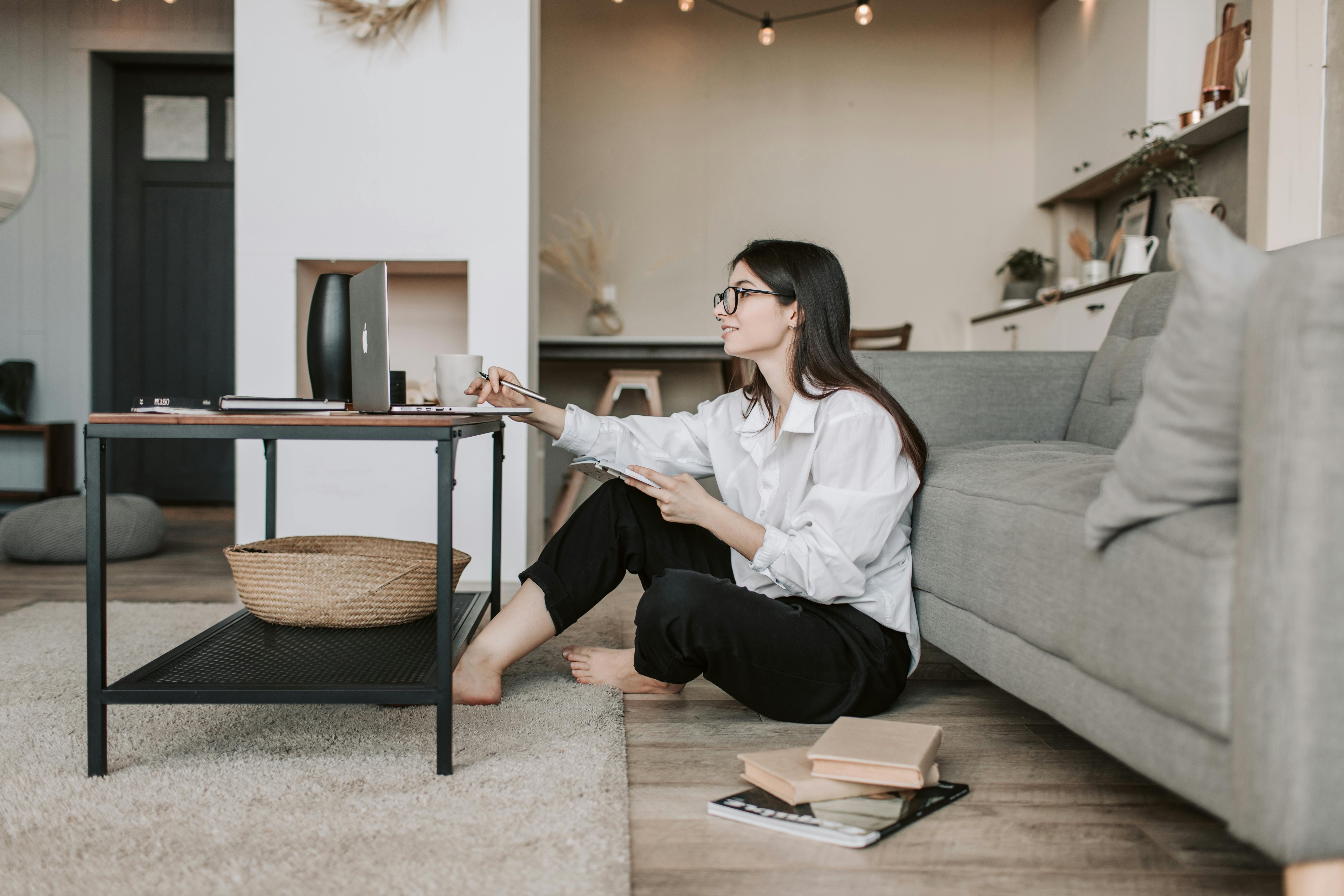 Remote team member working from home using a laptop, illustrating productive remote work setup for tech companies shifting to distributed teams.